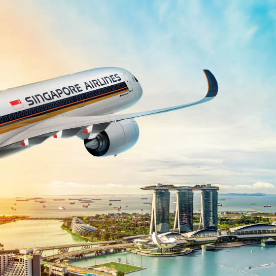 Aerial view of a Singapore Airlines aircraft above the iconic Marina Bay Sands.